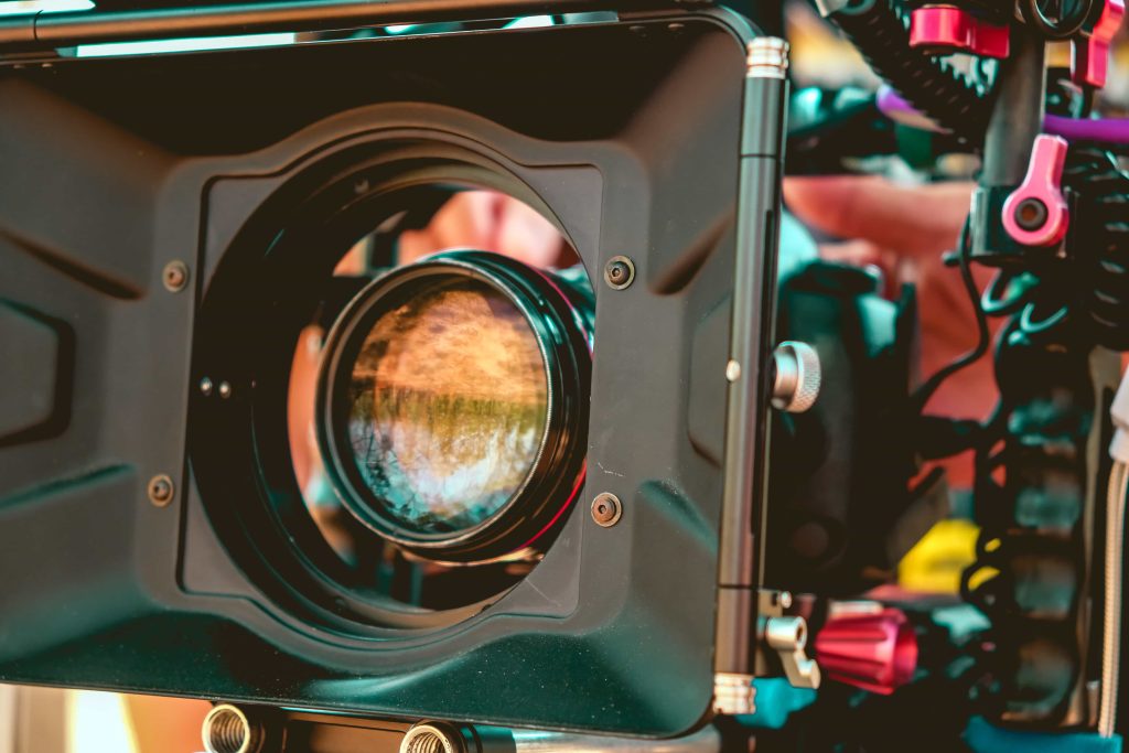 A professional camera crew filming a high-stakes corporate interview for a Chicago video production project.
