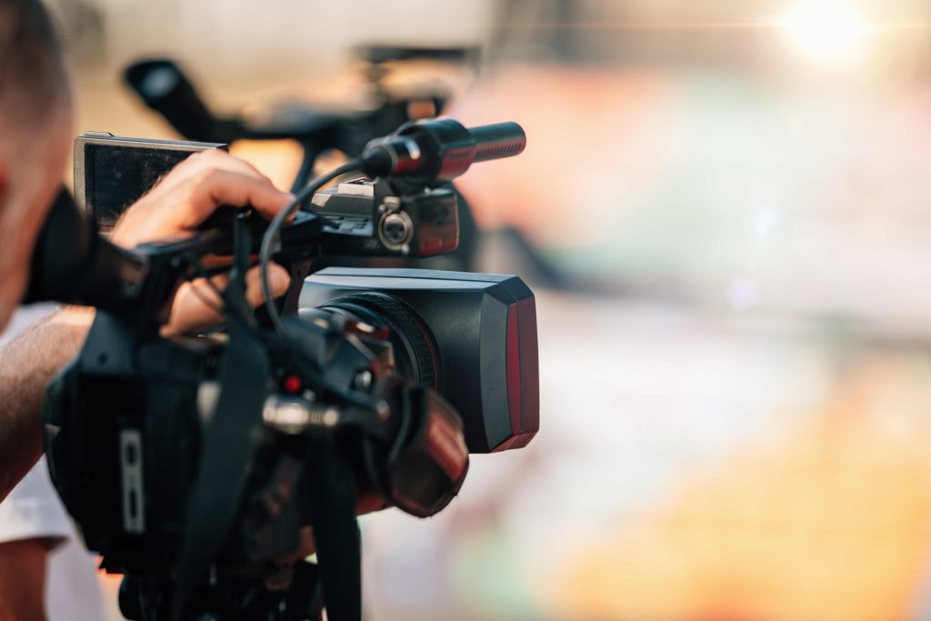 Professional New Orleans Video Production Company team from Tone Production capturing a soulful brand story near the Mississippi River using cinema-grade equipment