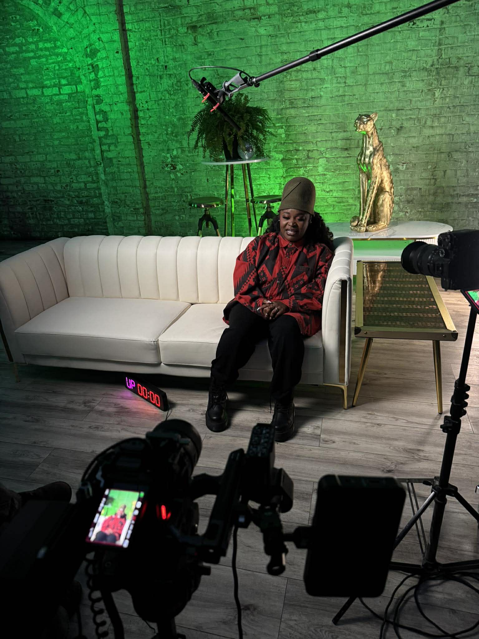Professional video production business gear laid out including camera, lenses, audio recorder, and lighting equipment