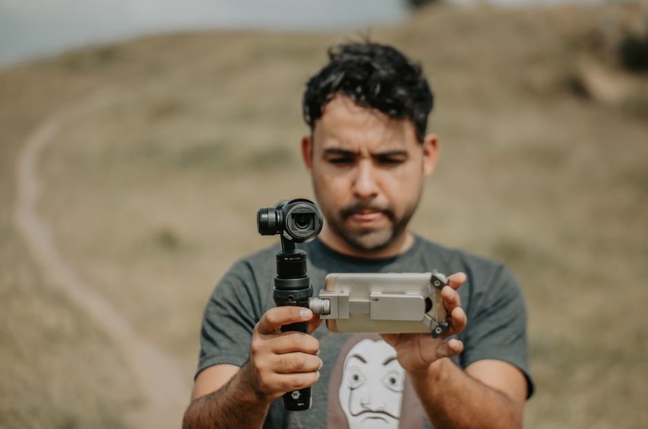 Filmmaker framing a vertical video shot in 9:16 aspect ratio on a camera rig