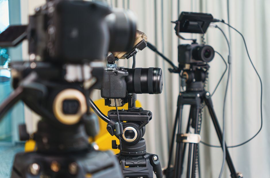 Best budget cameras for corporate video lined up on a production desk