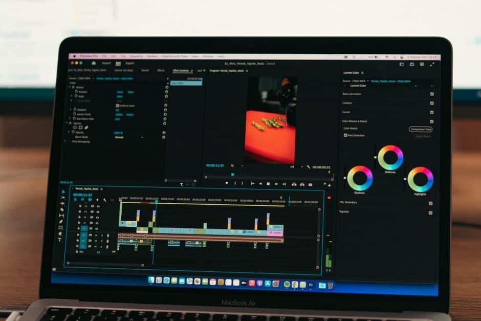 Marketer reviewing AI video tools for marketers on a laptop screen in a modern office