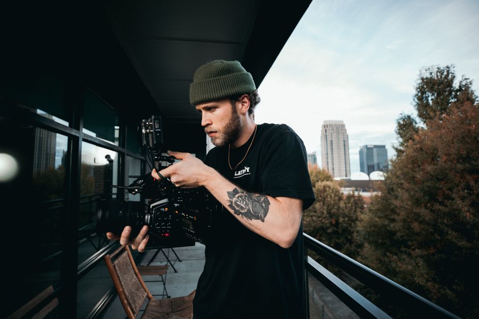 Atlanta videographers comparing AI-generated video and real footage for brand production in 2026