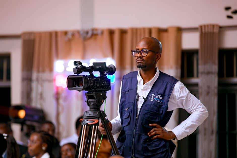 Corporate presenter using teleprompter tips for natural on-camera delivery in a professional video studio