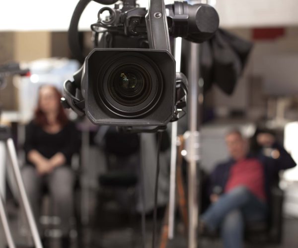 A professional Covington Video Production Company team from Tone Production filming high-energy social media content on location.