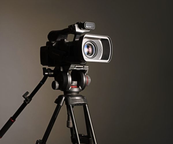 A professional Denver Video Production Company crew from Tone Production filming a high-impact brand story with the Denver skyline in the background.