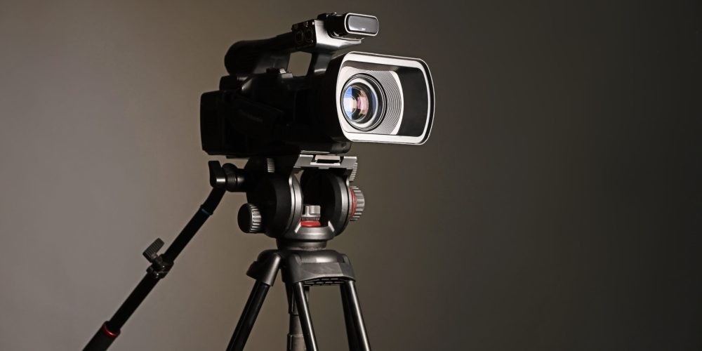 A professional Denver Video Production Company crew from Tone Production filming a high-impact brand story with the Denver skyline in the background.