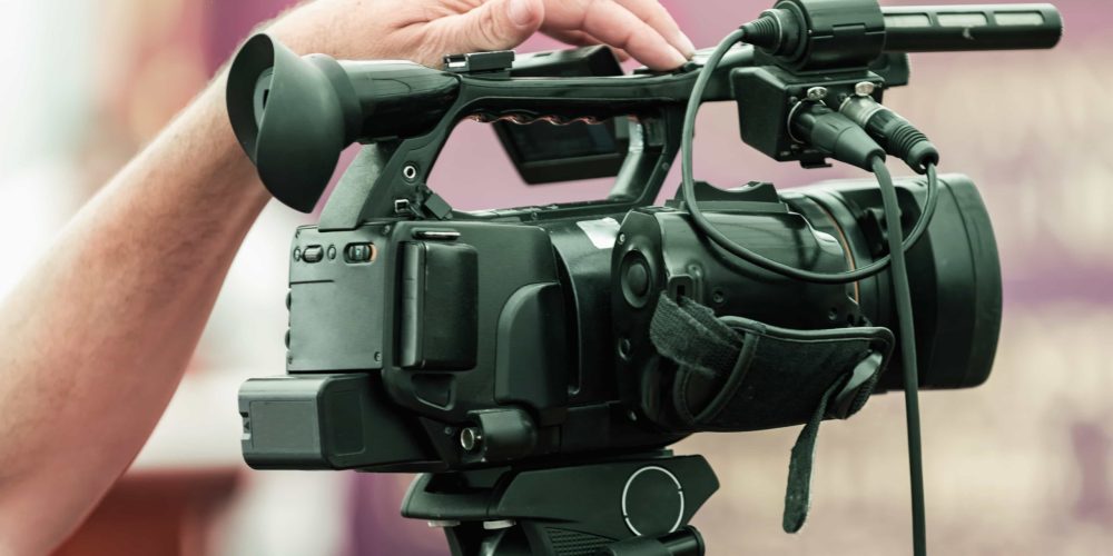 A professional Jackson Video Production Company team from Tone Production filming a high-impact corporate brand story in downtown Jackson, MS.