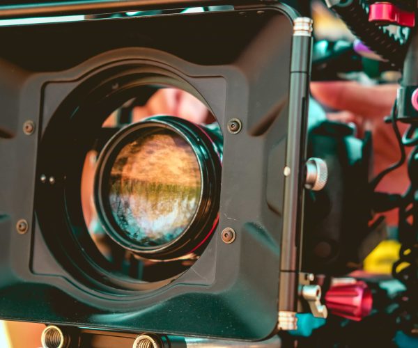 A professional camera crew filming a high-stakes corporate interview for a Chicago video production project.