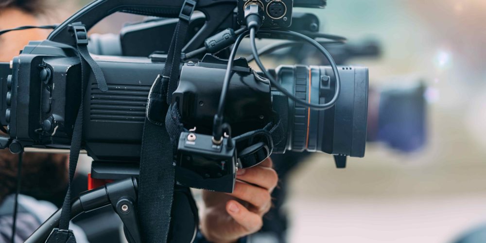 A professional team from a Baton Rouge Video Production & Creative Agency capturing systematic brand content at a corporate headquarters.