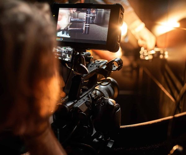 Elite New Orleans Video Production Company filming a high-end culinary experience at a luxury French Quarter restaurant by Tone Production.