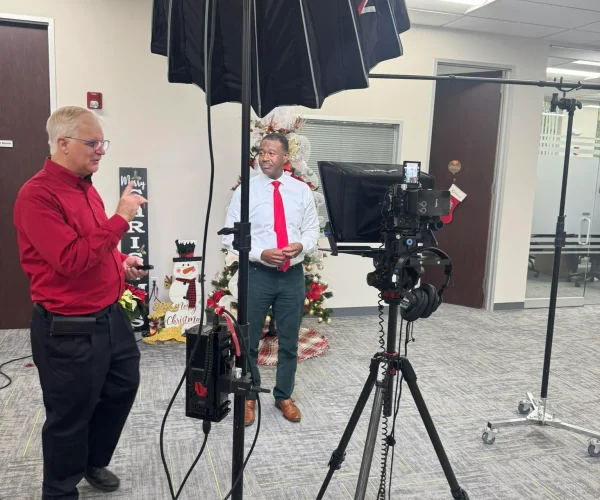 Houston Video Production Company filming a high-prestige corporate interview in a Houston skyscraper using a Sony FX3 rigged for 8K RAW.2