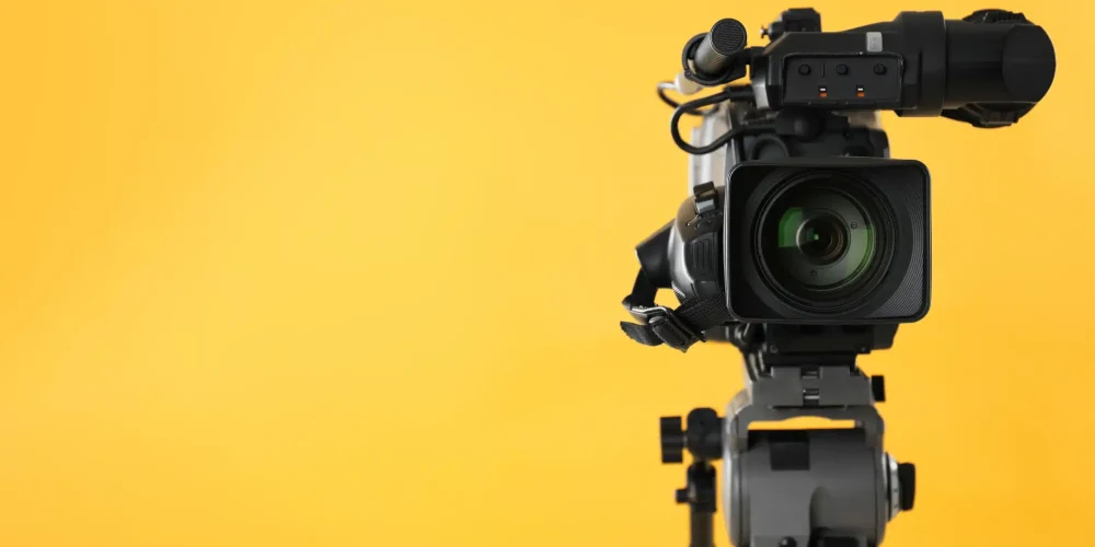Mobile AL video production company team testing cameras for professional video production