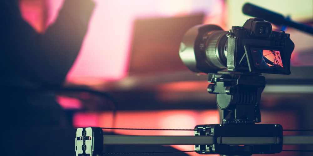 Professional Atlanta video Production Company Tone Production filming a dynamic corporate documentary in a modern Midtown Atlanta office.