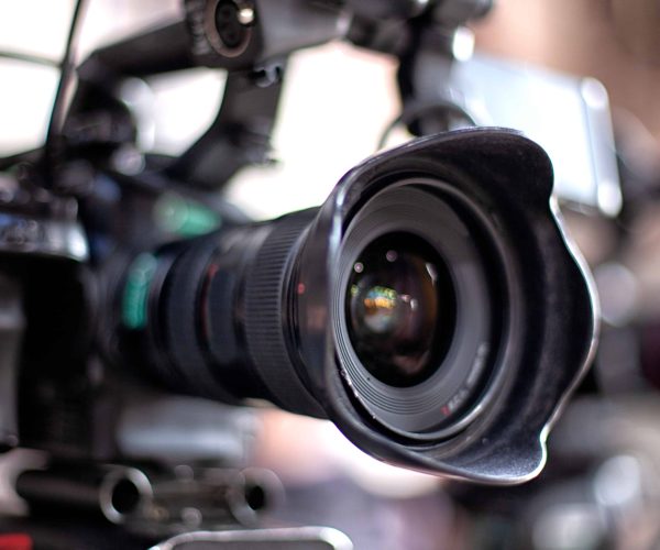 Professional Baton Rouge videographers from Tone Production filming a cinematic brand story at a local landmark for Video Production in Baton Rouge.