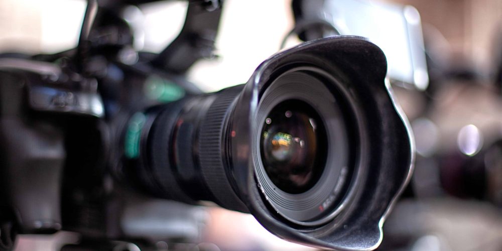 Professional Baton Rouge videographers from Tone Production filming a cinematic brand story at a local landmark for Video Production in Baton Rouge.