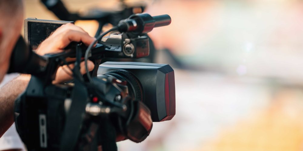 Professional New Orleans Video Production Company team from Tone Production capturing a soulful brand story near the Mississippi River using cinema-grade equipment