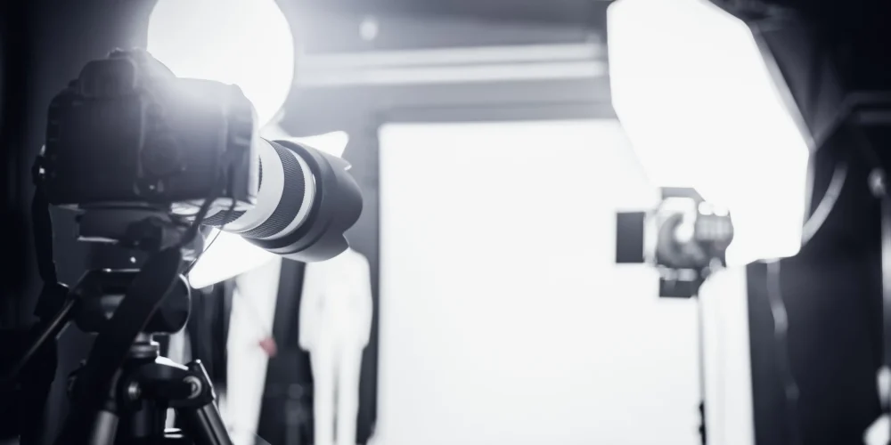 Scottsdale video production company comparing photography and videography setups for Arizona luxury business brand shoot in desert landscape