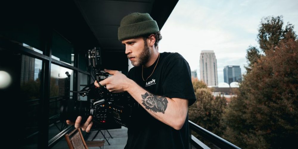 Atlanta videographers comparing AI-generated video and real footage for brand production in 2026