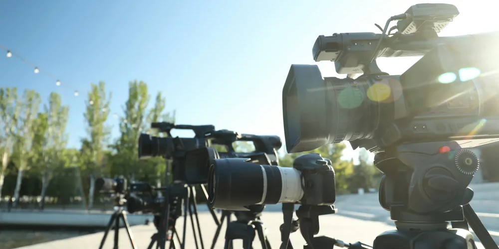 Production crew identifying common video production mistakes during a shoot review