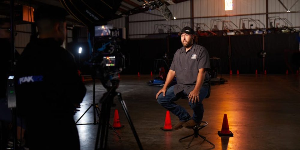 New Orleans videographers setting up cinematic three-point interview lighting for corporate video production