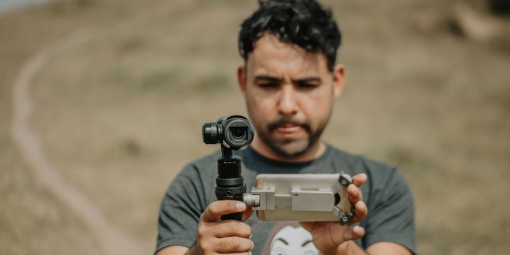 Filmmaker framing a vertical video shot in 9:16 aspect ratio on a camera rig