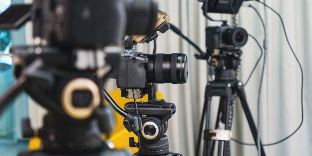 Best budget cameras for corporate video lined up on a production desk