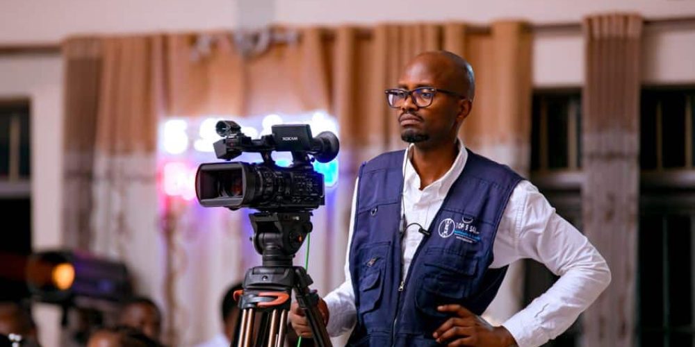 Corporate presenter using teleprompter tips for natural on-camera delivery in a professional video studio