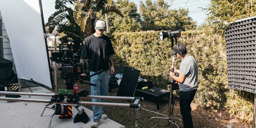 Tampa videographers from Tone Production reviewing optimal marketing video length on set in 2026