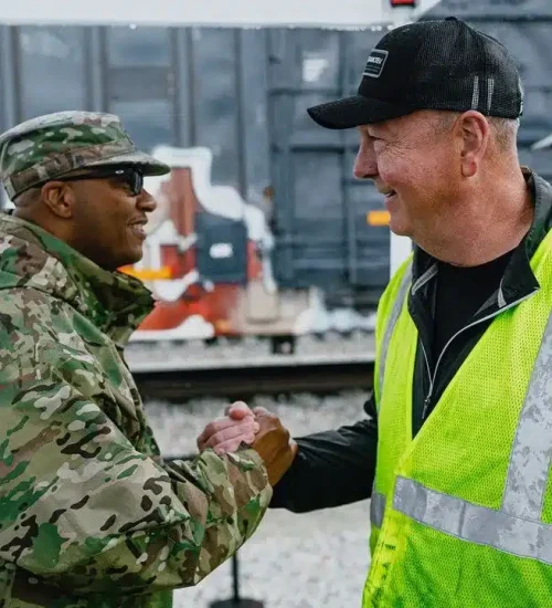 Tone Production filming a corporate video at a rail yard with military and operations personnel