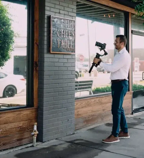 Tone Production videographer filming a restaurant brand video at The Chef's Table