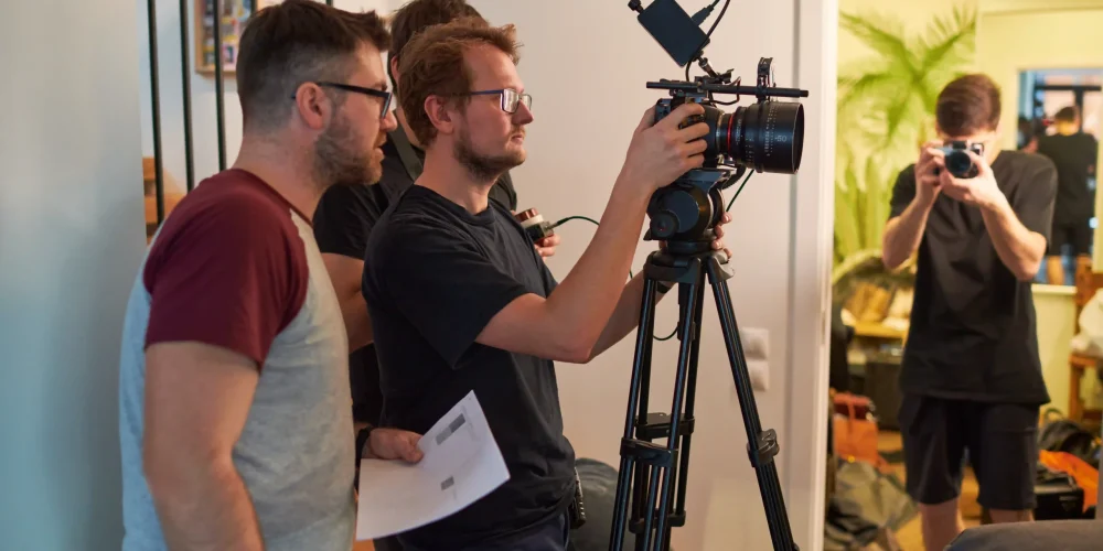 Benjamin Tone of Tone Production reviewing a charleston video production companies sc commercial brief with a Lowcountry South Carolina corporate client — 8K RAW cinema production planning session for a Charleston corporate brand film engagement