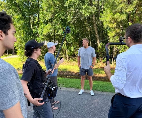 Benjamin Tone of Tone Production discussing Memphis video production lead generation strategy with a Tennessee brand client — 8K RAW cinema camera and professional lighting visible at a Memphis video production company commercial brief discovery session in Memphis Tennessee